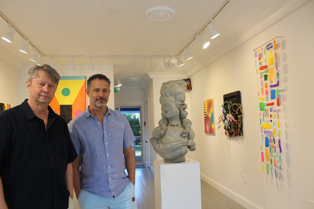 Curator Paul Laster and Marquee Projects Inc. gallery owner Mark Van Wagner at the recent “Seeing Red, Looking Blue, Feeling Green” exhibit in Bellport Village. The painting in back of Laster is Reed Anderson’s “Space Ghost.” Van Wagner is standing next to Jeff Muhs’s “Marie Antoinette, 2021.”